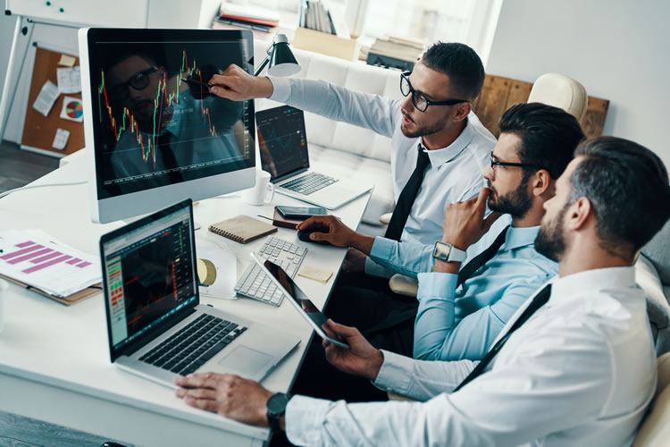 Traders in a meeting image